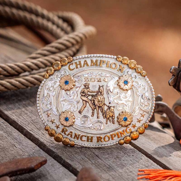 A custom rodeo belt buckle trophy for Ranch Roping featuring a calf roping figure 